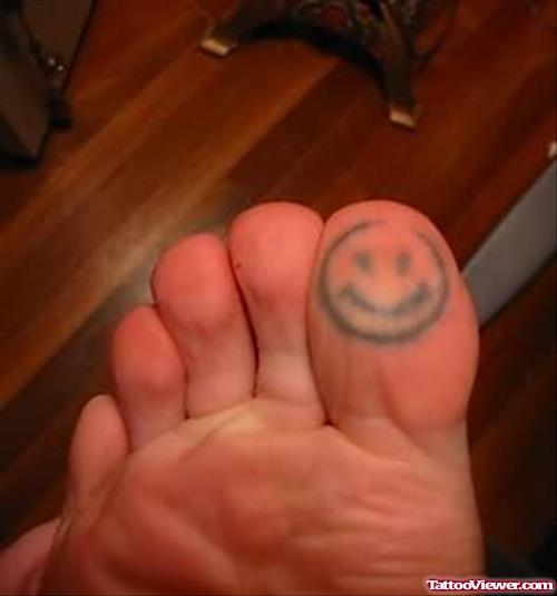 Smiley Tattoo Under Toe