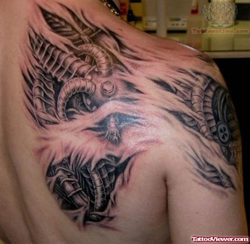 torn Skin Tattoo On Upper Shoulder