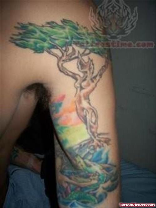 Colorful Tree Tattoo On Bicep
