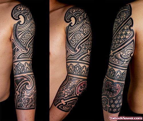 Japanese Black Ink Tribal Tattoo On Left Sleeve
