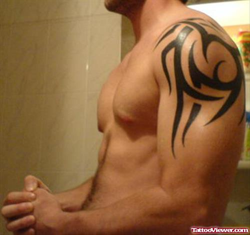 Attractive Left Shoulder Tribal Tattoo For Men