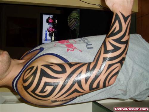 Black Ink Tribal Tattoo On Right Sleeve