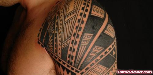 Black Ink Polynesian Tribal Tattoo On Left Shoulder