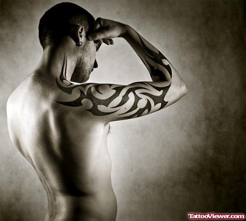 Amazing Black Ink Tribal Tattoo On Man Right Sleeve