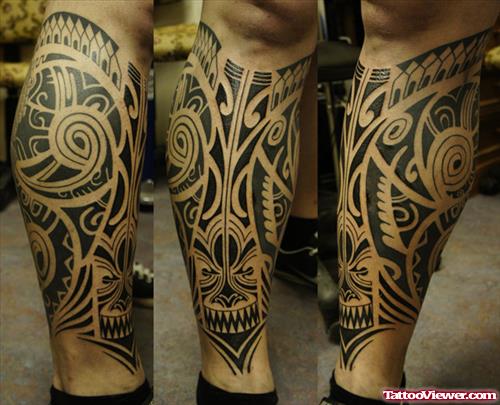Attractive Black Ink Tribal Tattoo On Leg