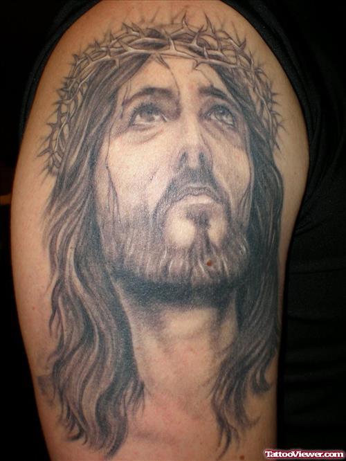 Tribal Jesus Head Tattoo On Right Shoulder