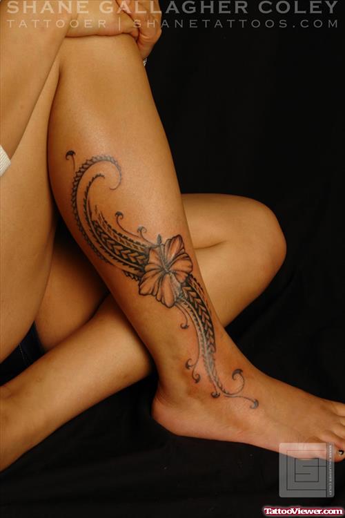 Grey Ink Lily Flower and Maori Tribal Tattoo On Right Leg