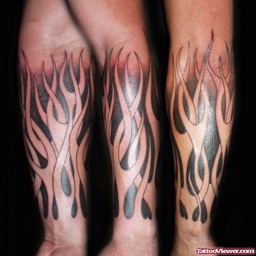 Flaming Tribal Tattoo On Arm