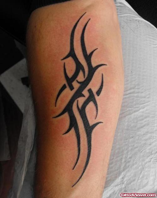 Amazing Black Ink Tribal Tattoo On Arm