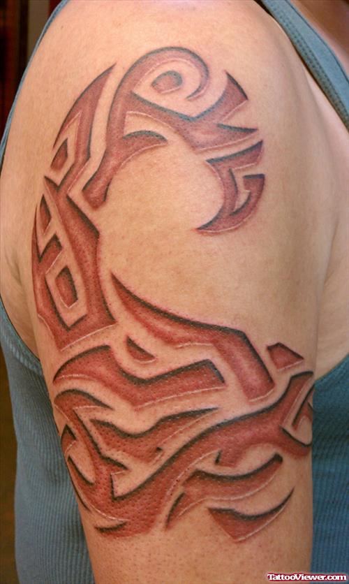 Red Ink Tribal Tattoo On Right Shoulder