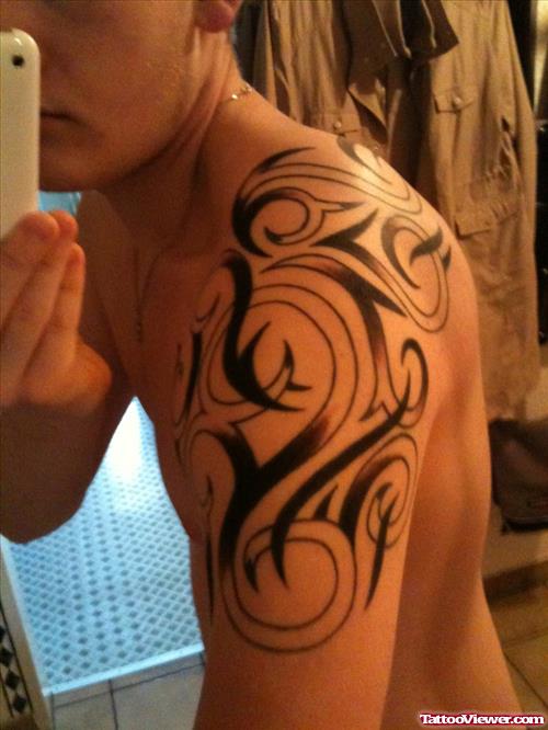Left Shoulder Black Ink Tribal Tattoo For Men