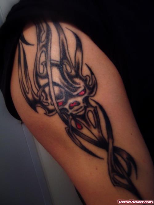 Red Eyes Tribal Dragon Tattoo On Half Sleeve