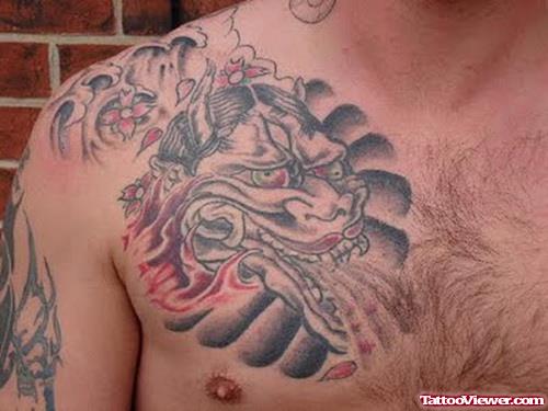 Grey Ink Tribal Tattoo On Man Chest