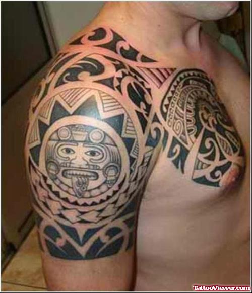 Black Ink Maori Tribal Tattoo On chest And Right Shoulder