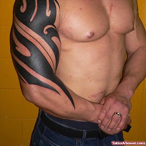 Black Ink Beautiful Tribal Tattoo On Right Sleeve