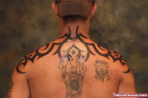 Amazing Black Ink Tribal Tattoo On Man Upperback