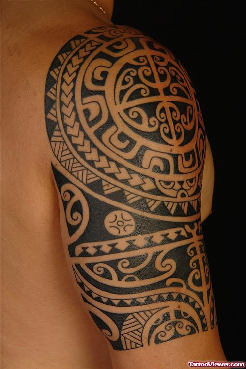 Amazing Black Ink Maori Tribal Tattoo On Right Half Sleeve