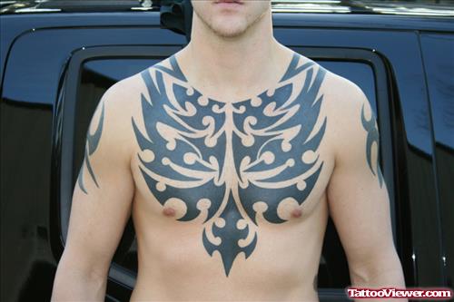 Awful Black Ink Tribal Tattoo On Man Chest