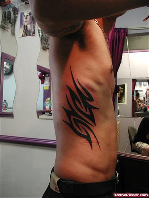 Tribal Black Ink Tattoo On Side
