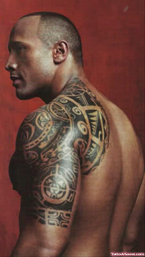Black Ink Maori Tribal Tattoo On Left Shoulder