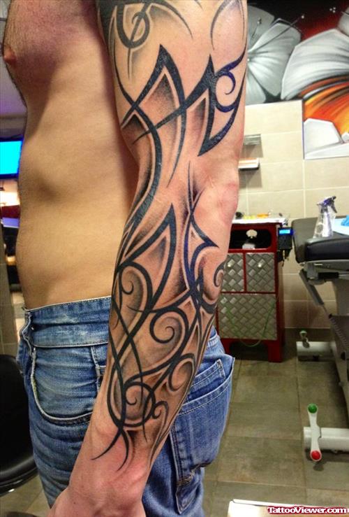 Awesome Left Sleeve Black Ink Tribal Tattoo For Men