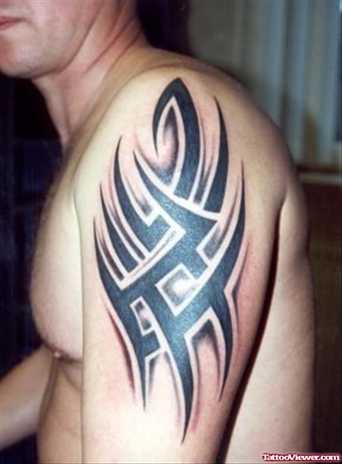 Attractive Left Shoulder Black Ink Tribal Tattoo For Men