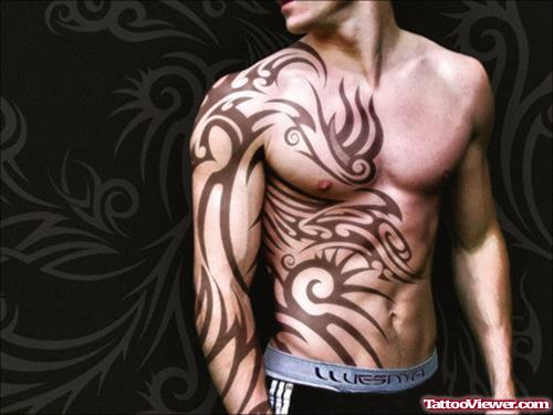 Tribal Tattoo On Chest And Right Sleeve