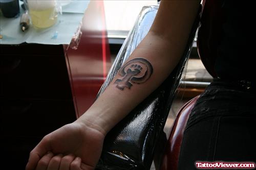 Tribal Cross And Circle Grey Ink Tattoo On Arm