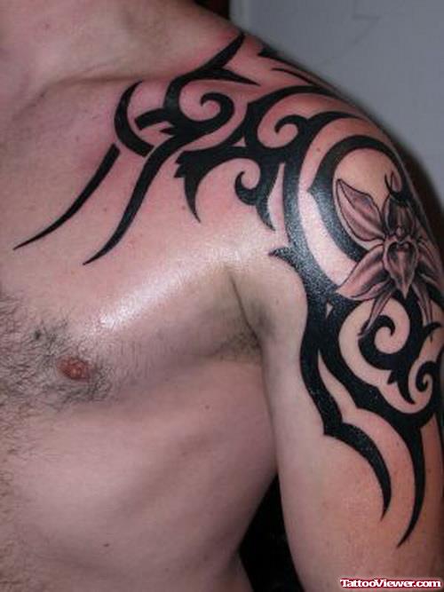 Flower And Tribal Tattoo On Man Left Shoulder