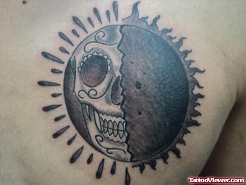 Skull And Tribal Sun Tattoo On Right Back Shoulder