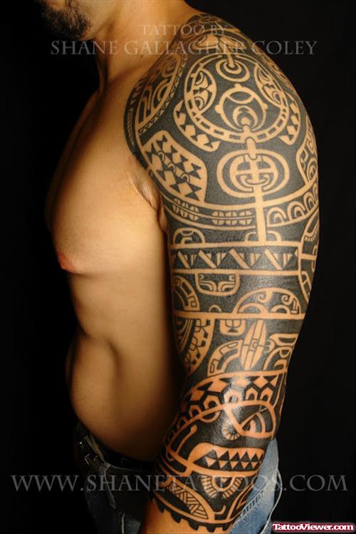 Man With Tribal Tattoo On Left Sleeve