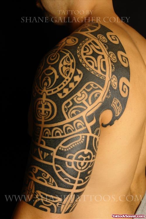 Left Half Sleeve Black Ink Tribal Tattoo For Men