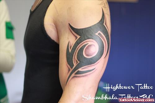 Black Ink Tribal Left Bicep Tattoo For Men
