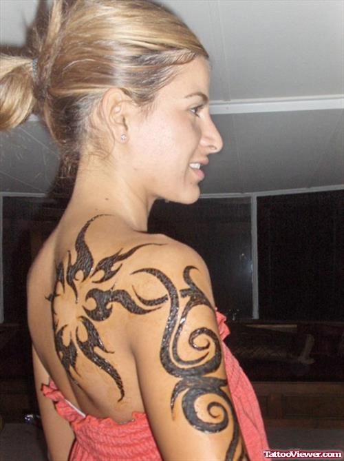 Black Ink Tribal Tattoos On Half Sleeve And Back Shoulder