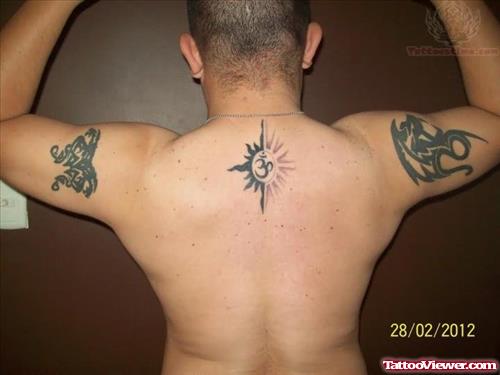Om Tattoo On Upperback And Tribal Tattoo On Half Sleeve