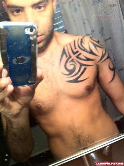 Tribal Tattoo on Shoulder And Chest