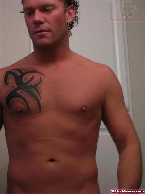 Tribal Tattoo On Men Right Chest