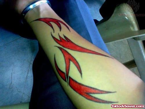 Red Tribal Tattoo On Forearm