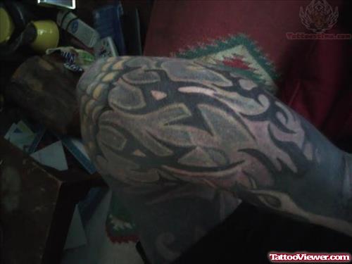 Flame And Tribal Tattoo On Arm