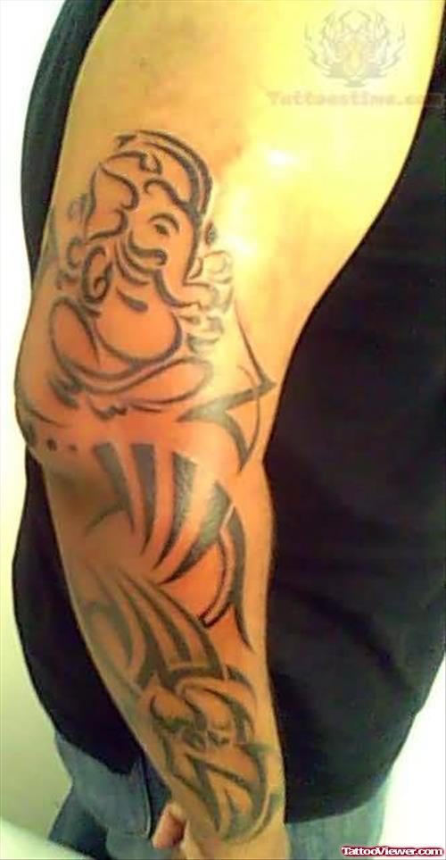 Tribal and Lord Ganesha Tattoo On Arm