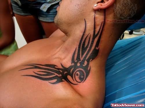 Tribal Tattoo On Collarbone And Neck