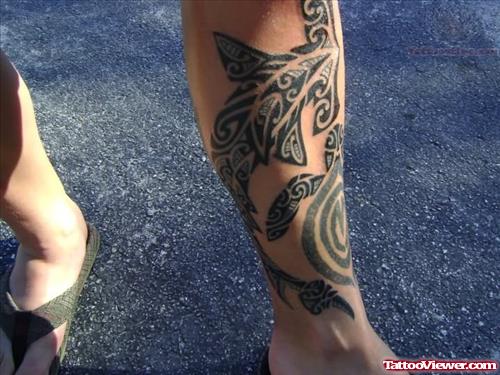 Tribal Hammer Head Tattoo On Leg