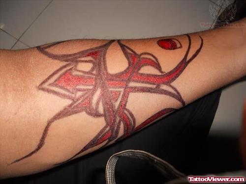 Red Ink Tribal Tattoo On Arm