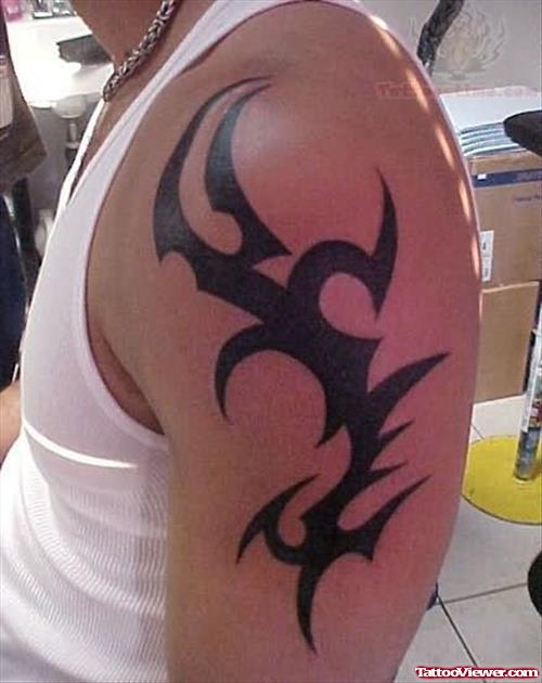Black Tribal Tattoo On Left Shoulder
