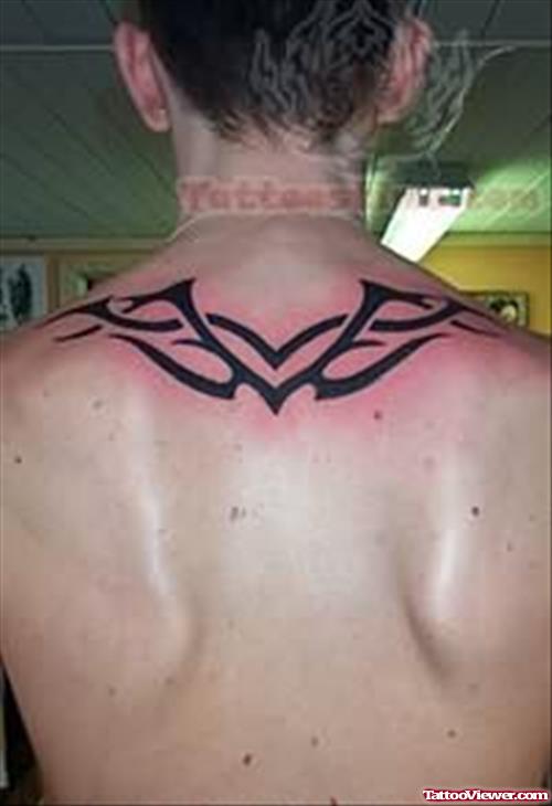 Pink Outline Tribal Tattoo