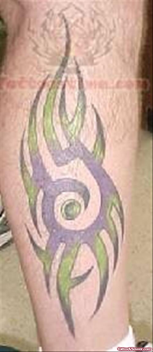 Green and Purple Coloured Tribal Tattoo
