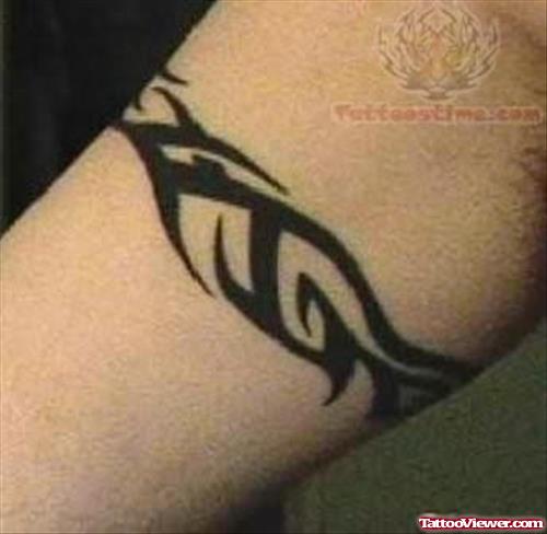Tribal Tattoo On Muscle