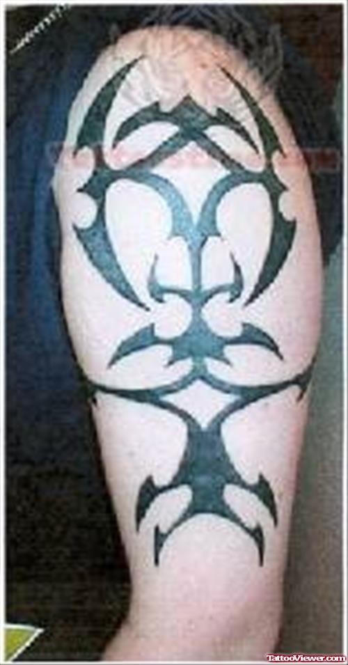 Shining Black Tribal Tattoo On Left Arm