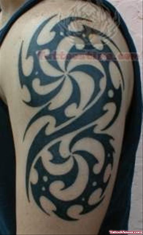 Black Tribal Tattoo On Left Biceps