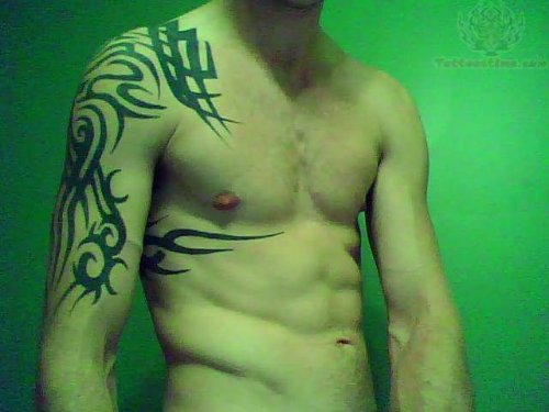 Tribal Tattoo On Shoulder And Bicep For Men